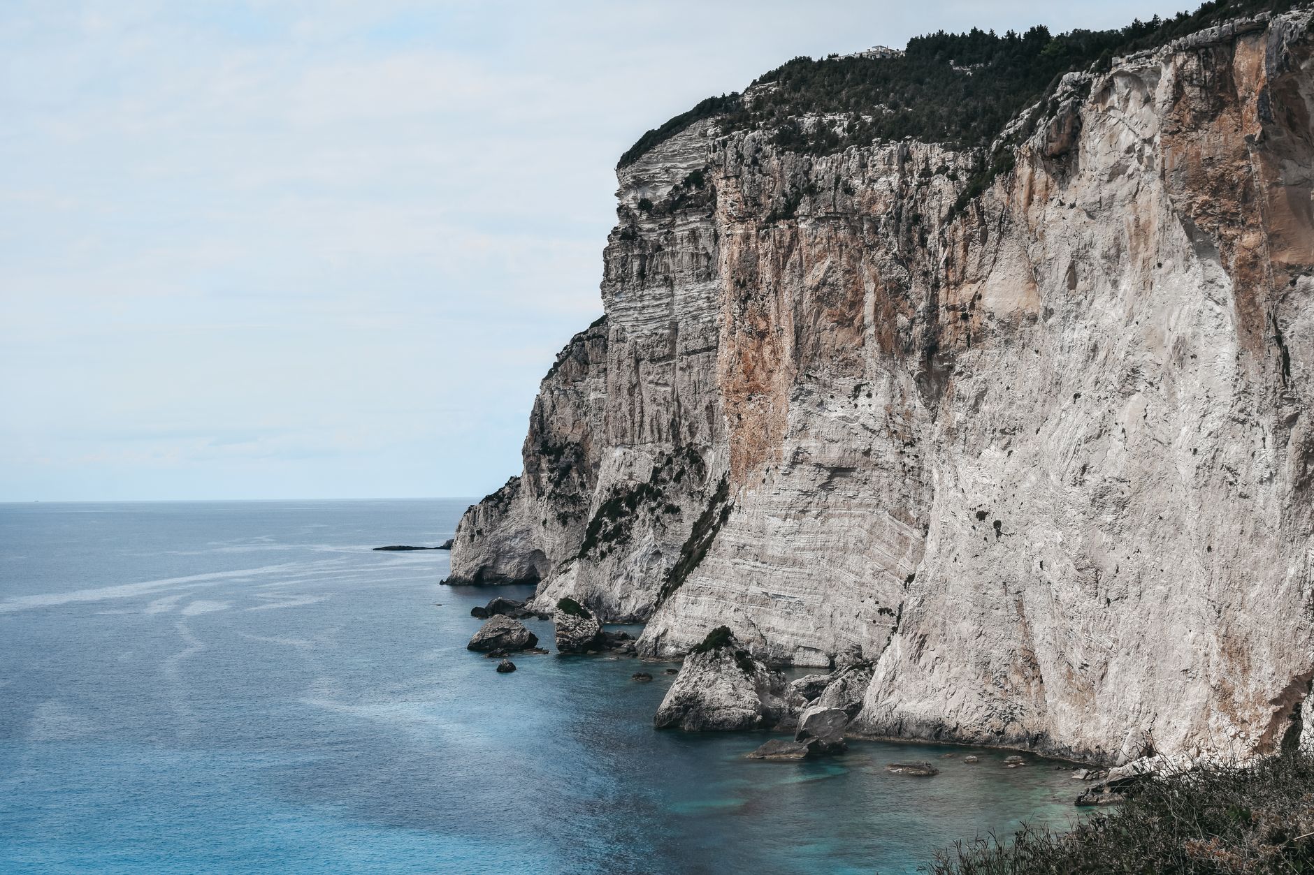 Aegean sea crashing against rocky island shores